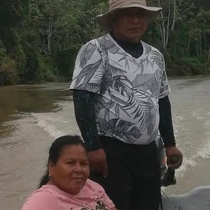 Missionaries traveling by boat through the Panama jungle to reach remote villages