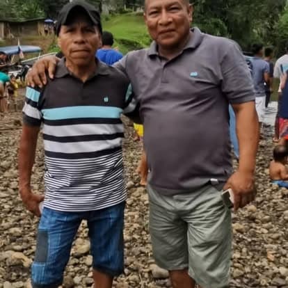 Wounaan men on a riverbank in the Darien province of Panama